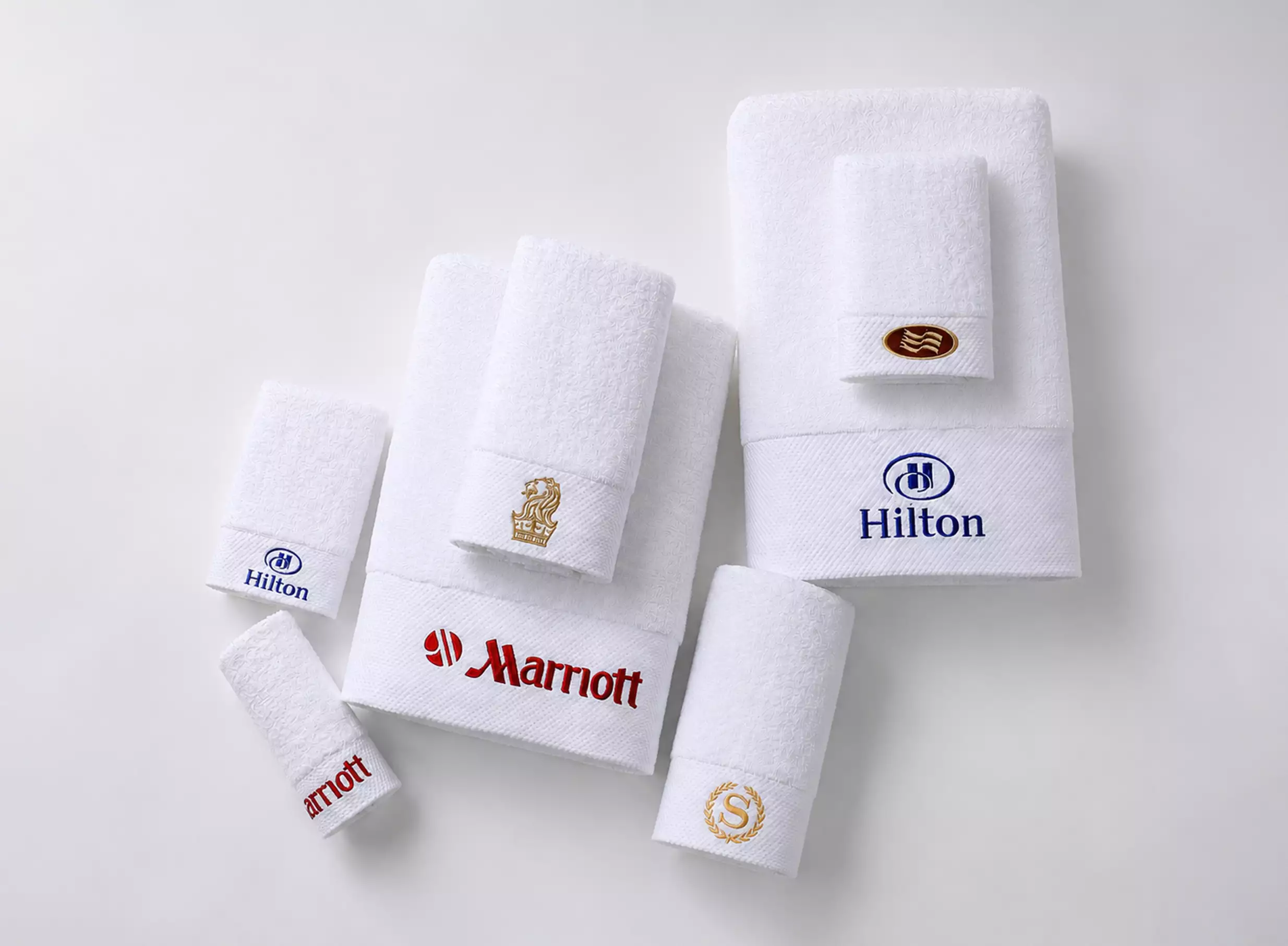 Custom hotel branding on linen with embroidered logo