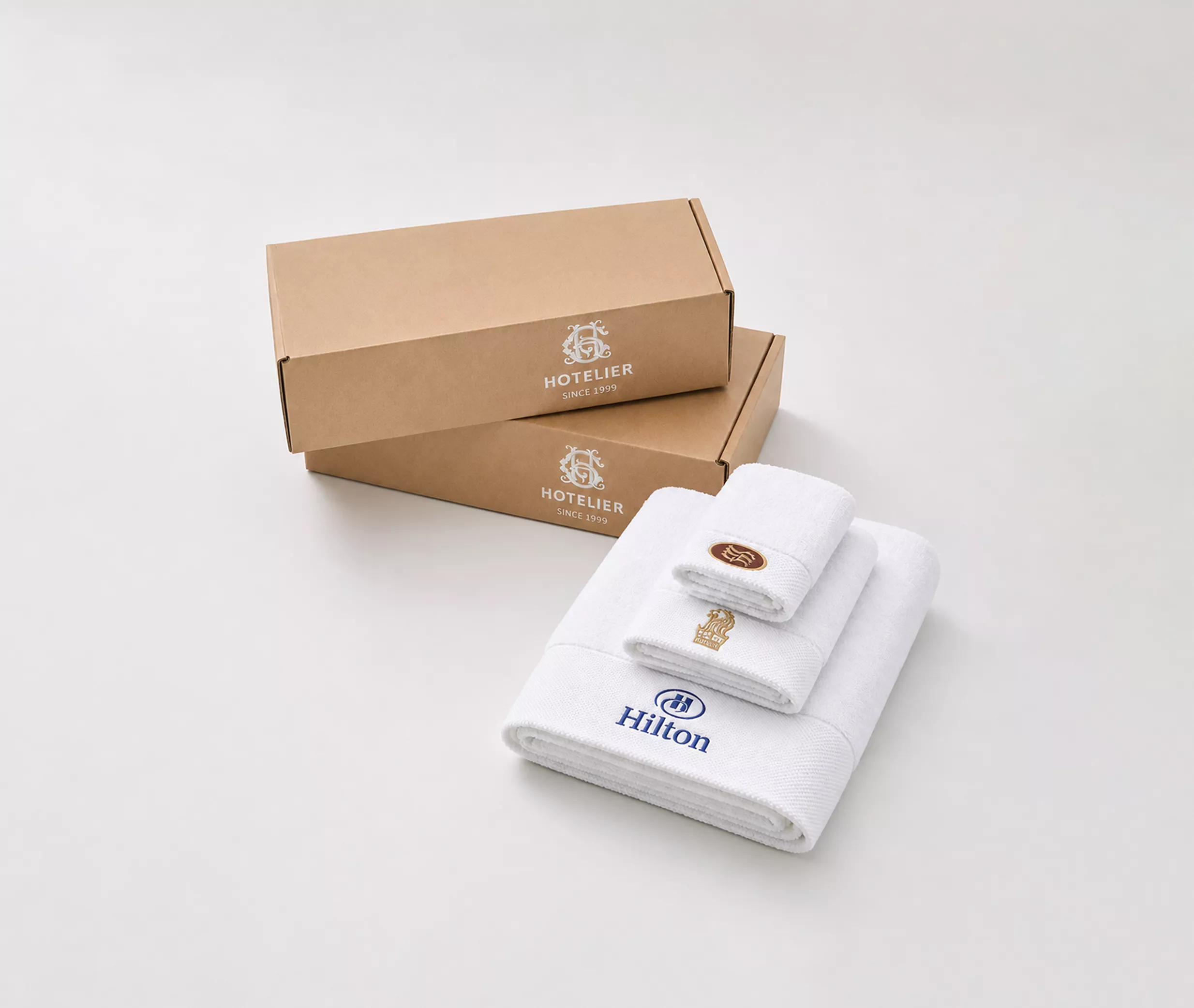Custom hotel branding on linen with embroidered logo